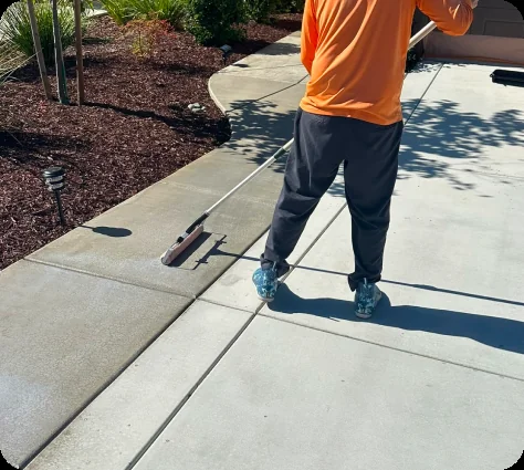 Professional driveway and walkway power washing detail cleaning concrete edges for improved safety